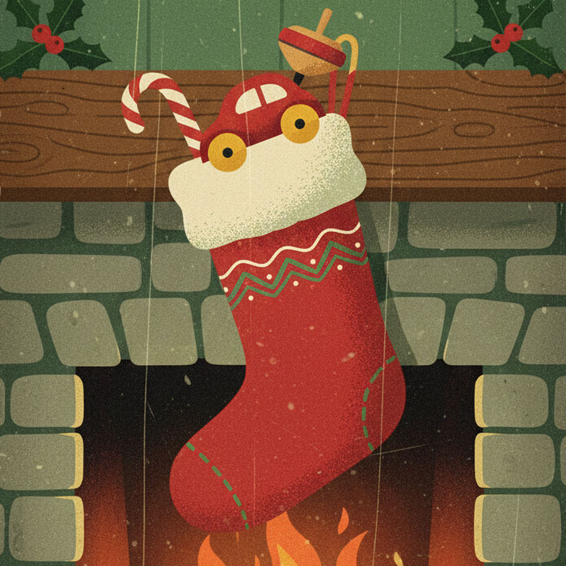 A Christmas stocking filled with a toy car, top, and candy cane, hangs from the mantle of a stone-faced fireplace. Holly adorns the fireplace. A fire crackles in the hearth.